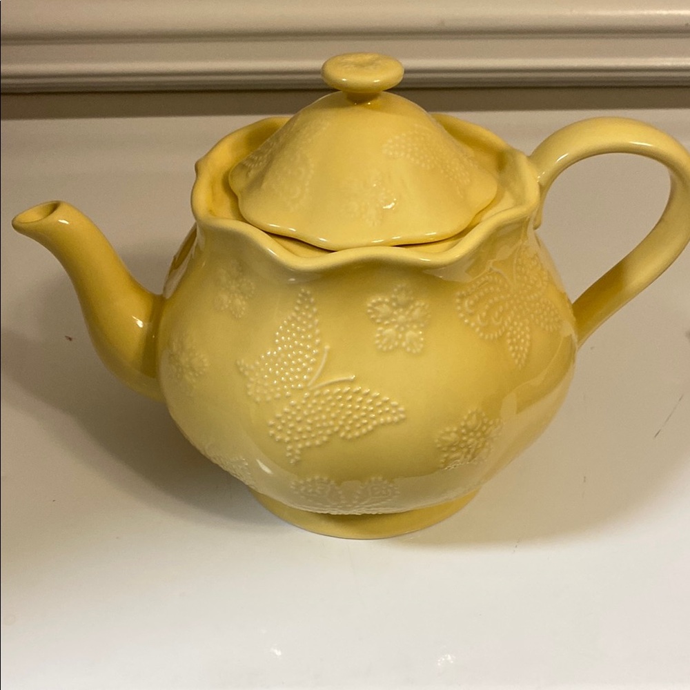 Elegant Yellow Teapot with Butterfly Design